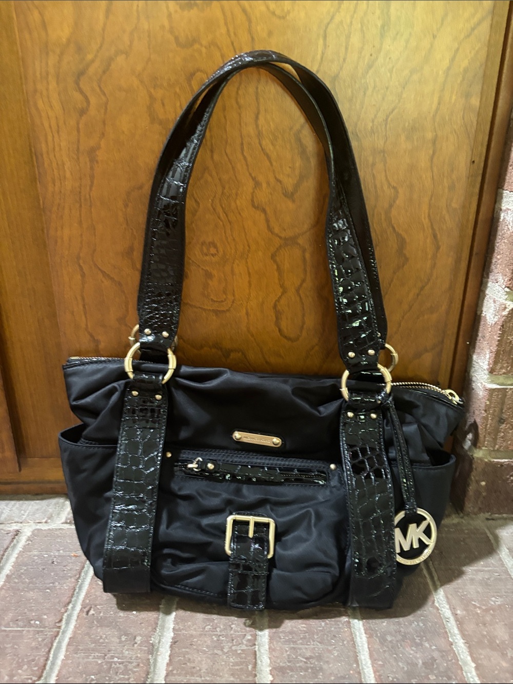 Rarely used black nylon and leather Michael Kors handbag.
